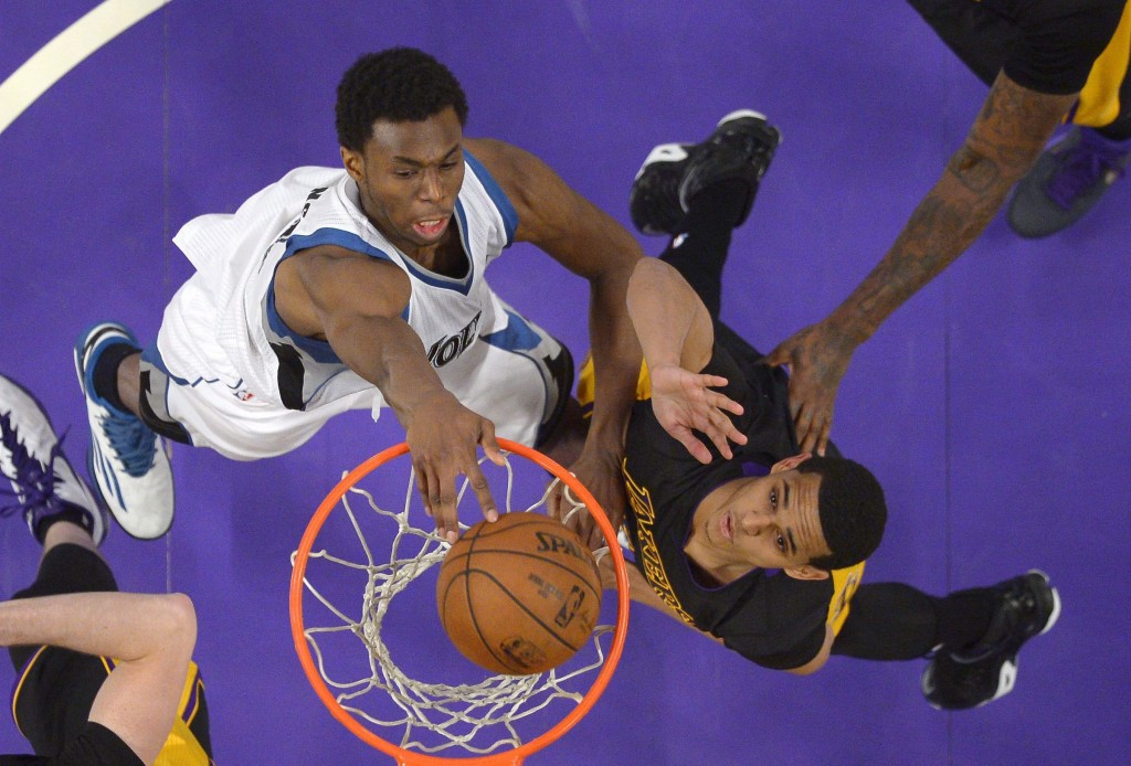Minnesota Timberwolves forward Andrew Wiggins, left, dunks as Los Angeles Lakers guard Jordan Clarkson defends during the second half of an NBA basketball game on April 10, 2015, in Los Angeles. THE ASSOCIATED PRESS/Mark J. Terrill