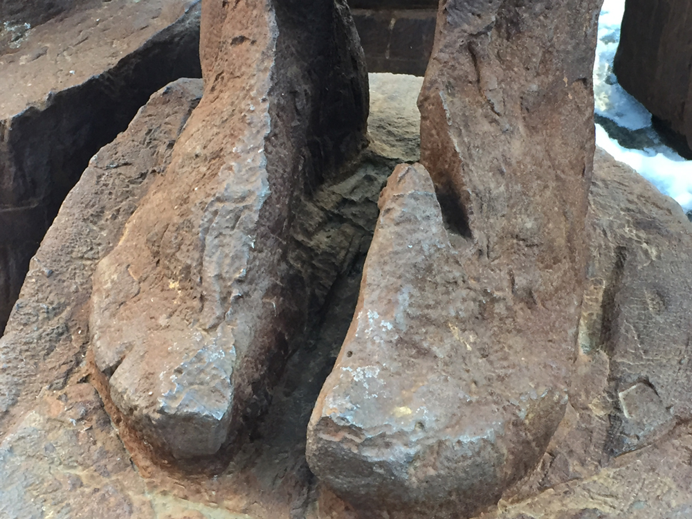 The feet of the figures in Full Circle, a sculpture at Queen and Victoria streets in Toronto, April 5, 2016 CITYNEWS/Diana Pereira