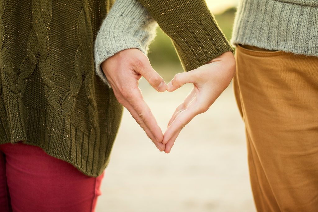 Two people holding hands