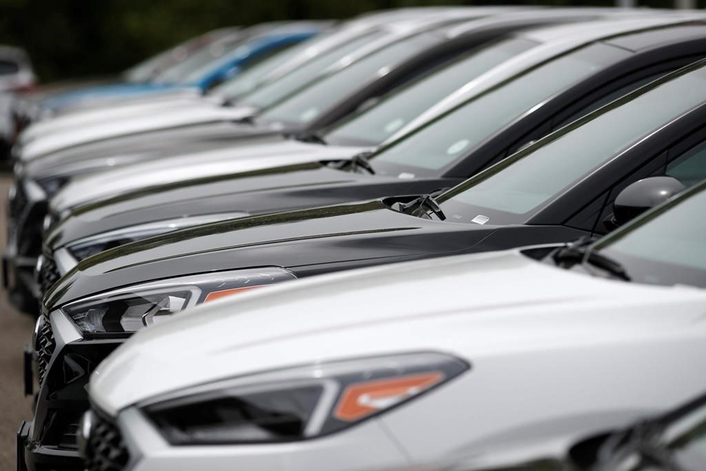 FILE - In this May 19, 2019, file photo, a line of unsold 2019 Tucson sports-utility vehicles sits at a Hyundai dealership in Littleton, Colo