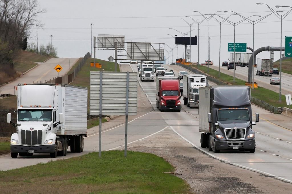 A truck exits at the Hefner Road exit of I-35 in Oklahoma City, Friday, March 20, 2020.