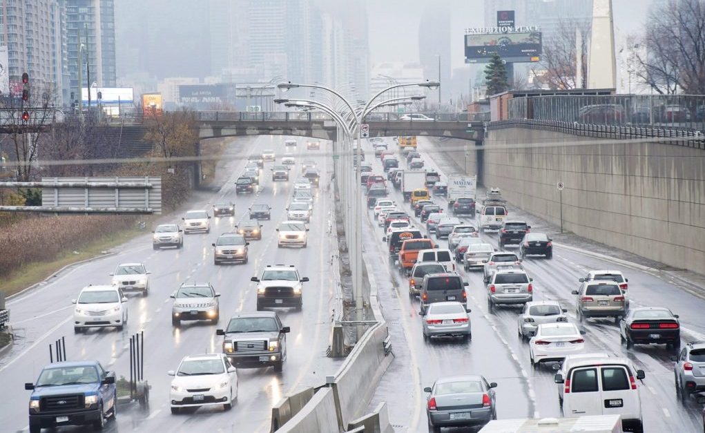 Vehicles makes their way into and out of downtown Toronto along the Gardiner Expressway in Toronto