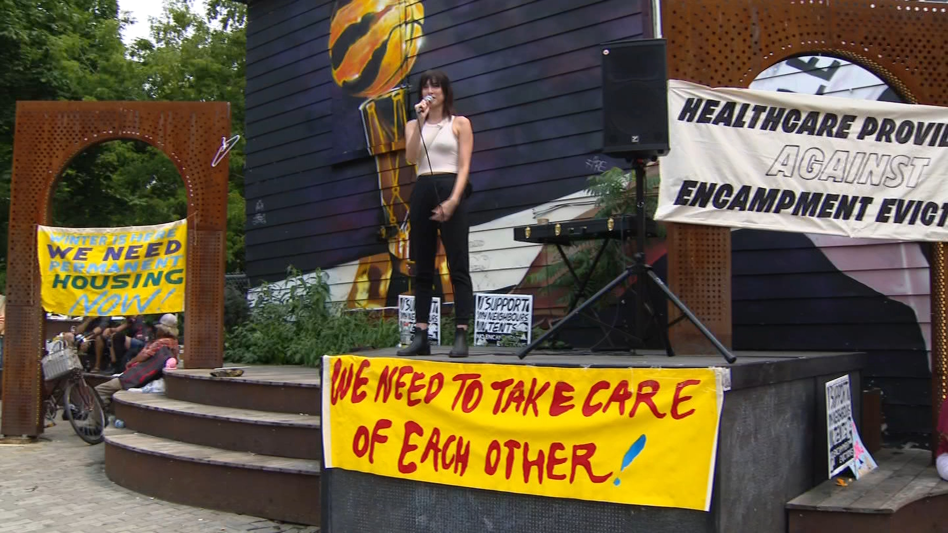 Diana Chan McNally, training and engagement coordinator for the Toronto Drop-In Network, speaks at a demonstration in support of unhoused park residents who were evicted from Alexandra Park by the city on July 20, 2021. CITYNEWS