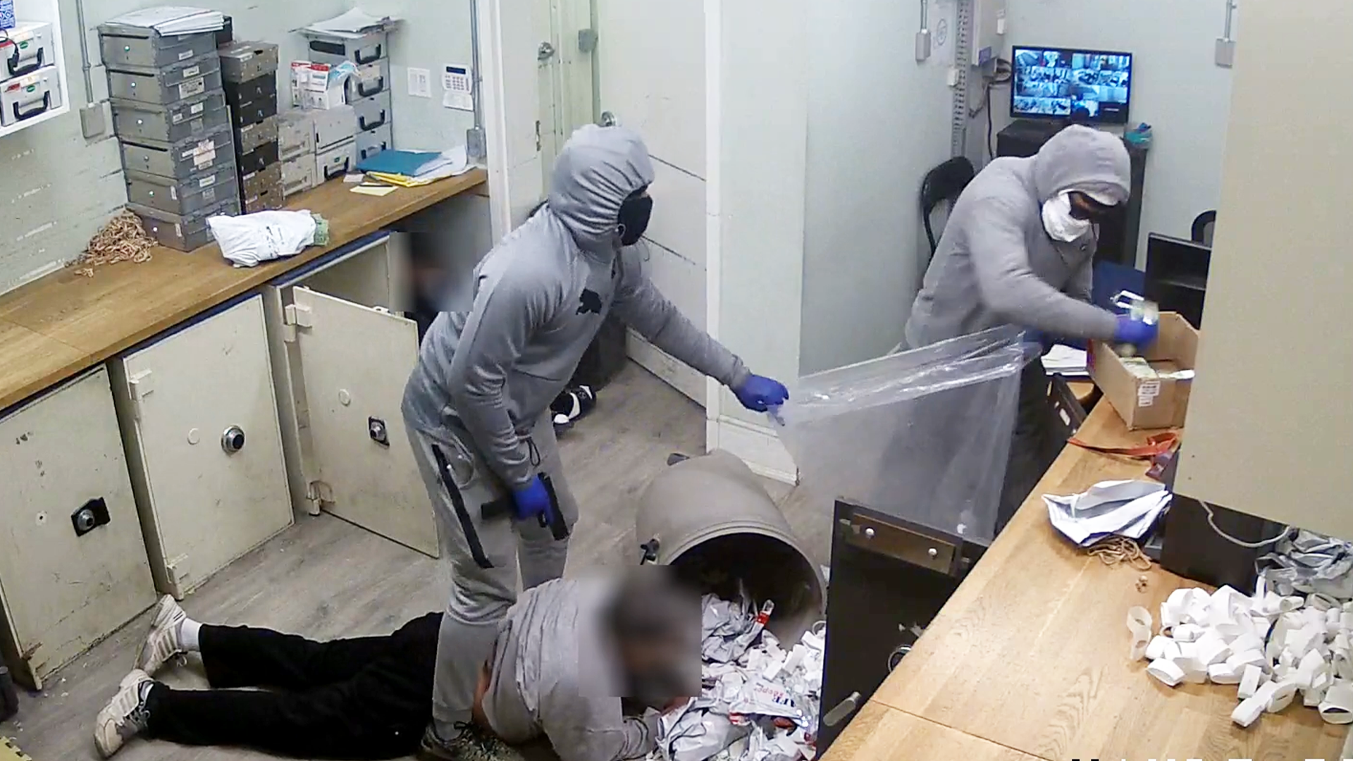 Multiple arrests made, 1 man wanted in million dollar robbery investigation