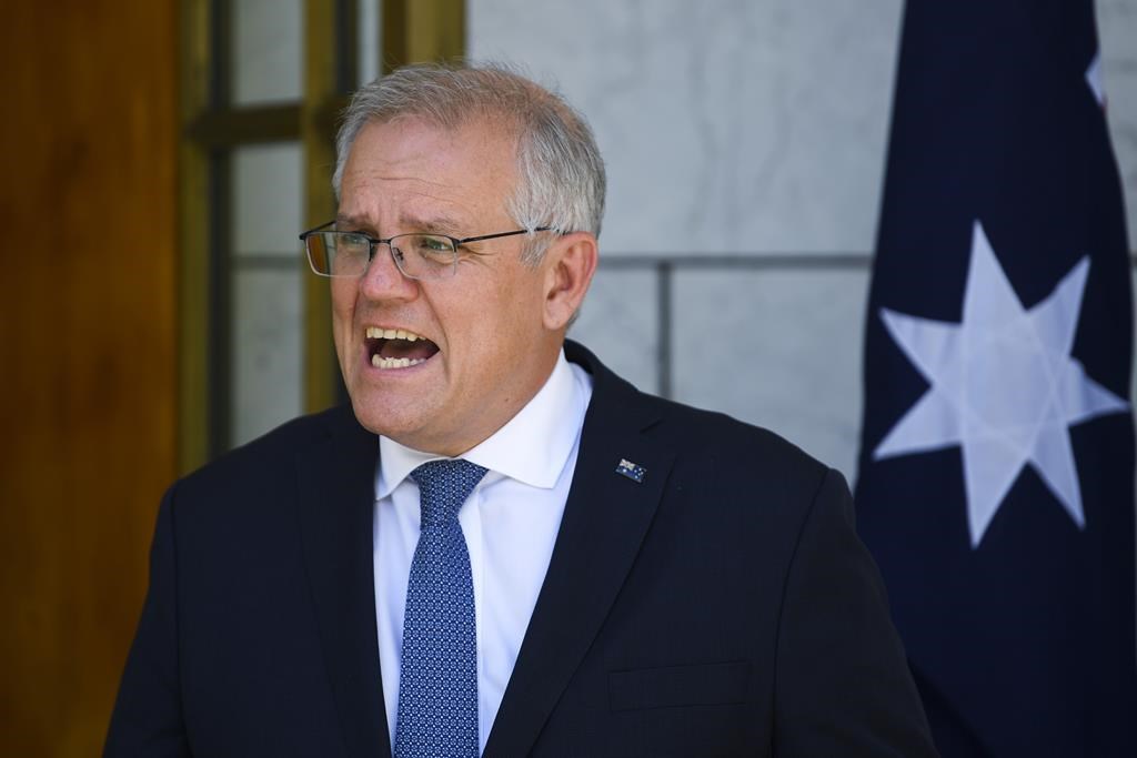 Australia PM meets with state leaders as virus cases surge