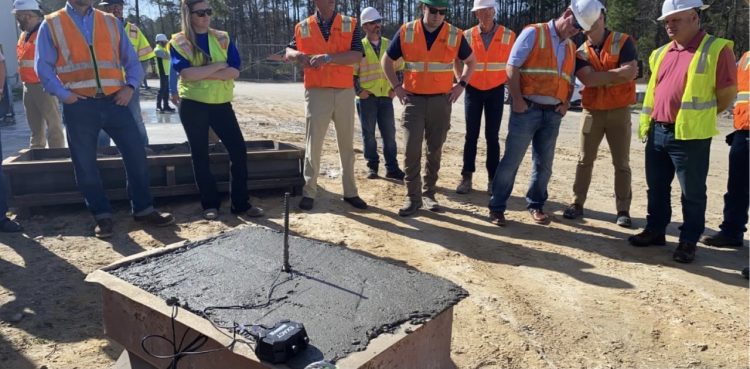 Stacia Van Zetten with construction crew at a site 