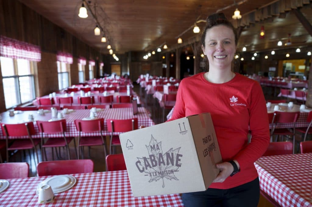 Camelie Gingras is seen holding a home delivery box