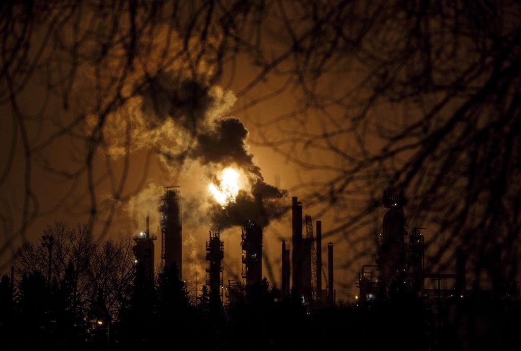 A flare stack lights the sky along refinery row in Edmonton