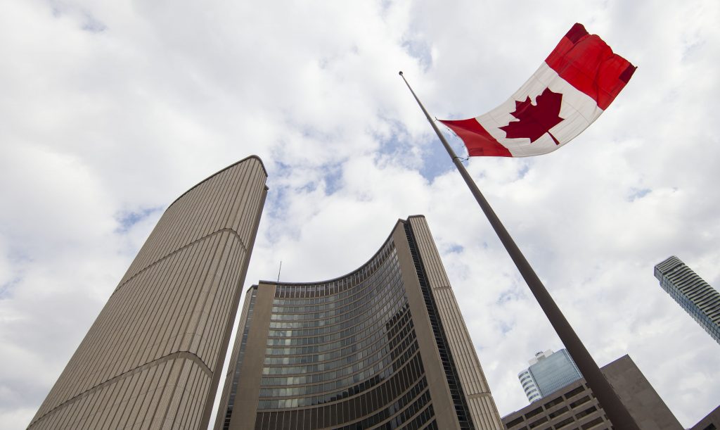 The Canadian national flag flies at half-mast at the Nathan Philips Square in Toronto, Canada, on March 11, 2021.