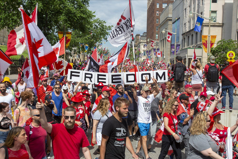 Protesters march for freedom as larger crowds celebrate Canada Day in Ottawa