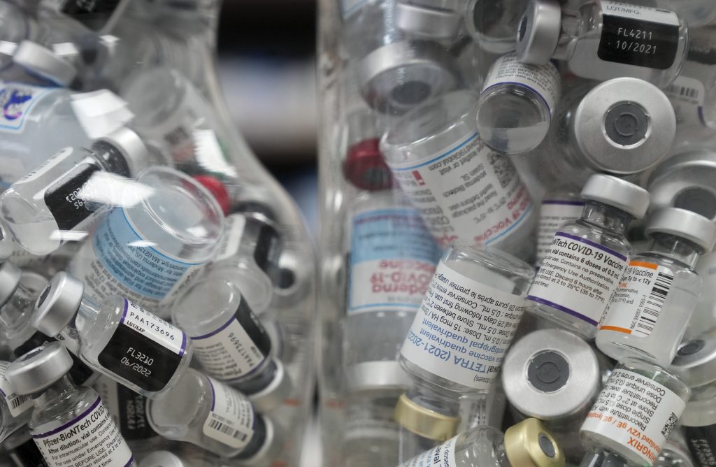 Jars full of empty COVID-19 vaccine vials are shown at the Junction Chemist pharmacy during the COVID-19 pandemic in Toronto on Wednesday, April 6, 2022.