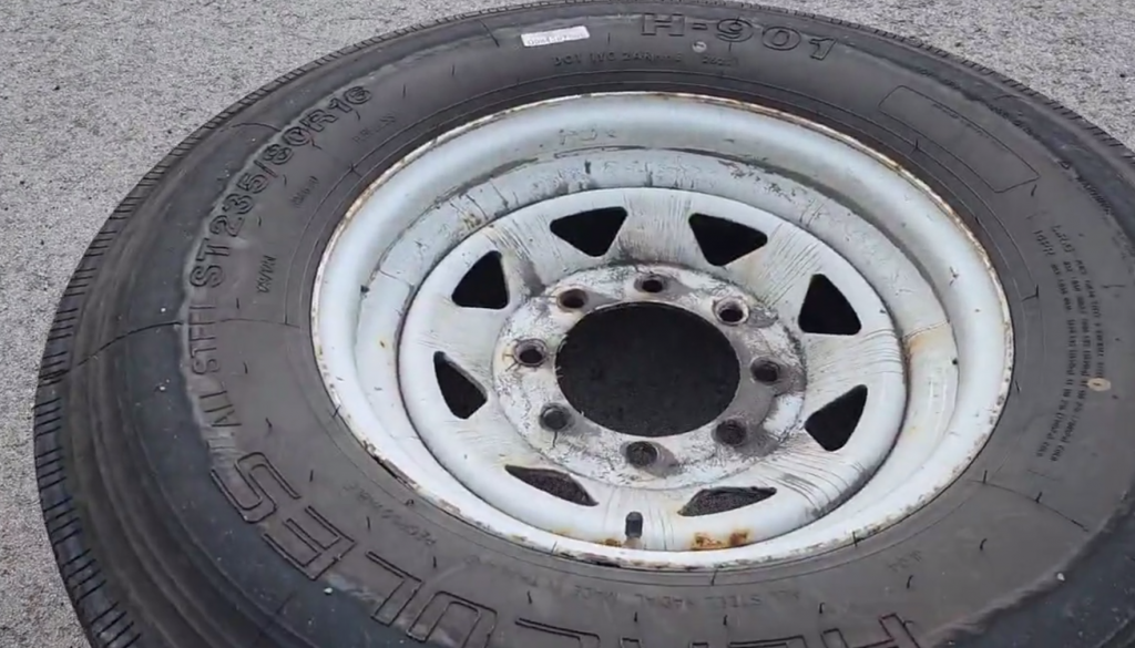 OPP located an inflated tire mounted on a wheel on the side Highway 407