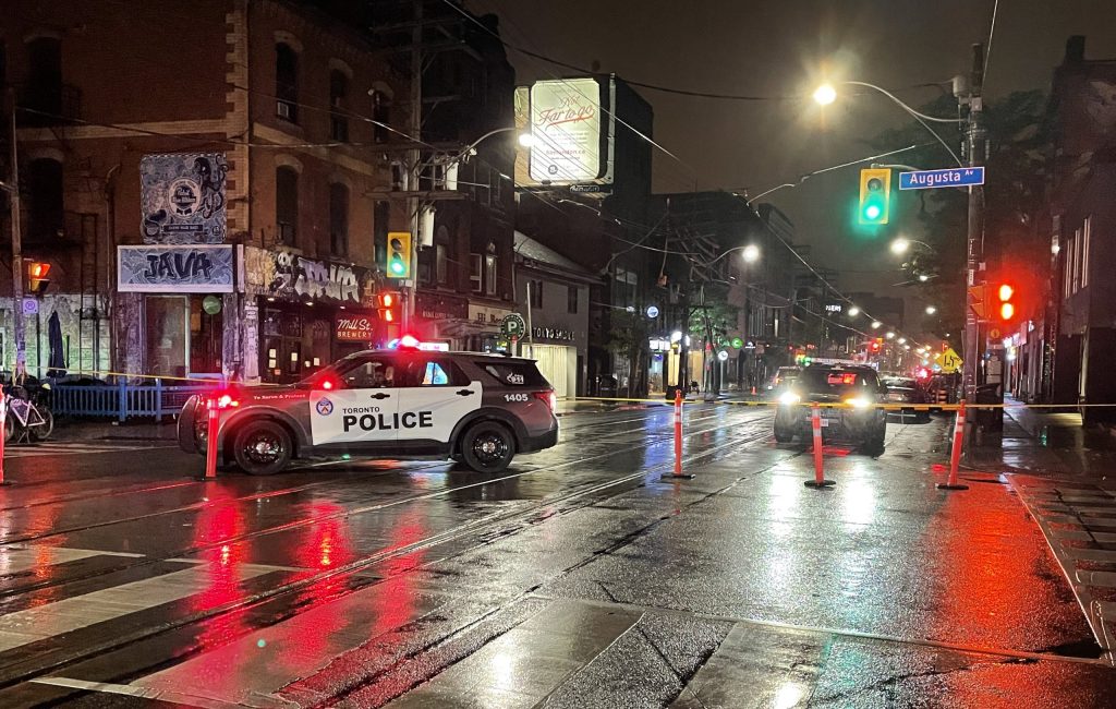 Toronto police investigate after three people were injured following a shooting at a nightclub on Queen Street West in Toronto on Sep. 12, 2022