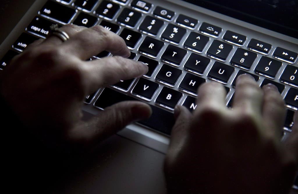 Hands type on a keyboard in North Vancouver, B.C., on Wednesday, December, 19, 2012.