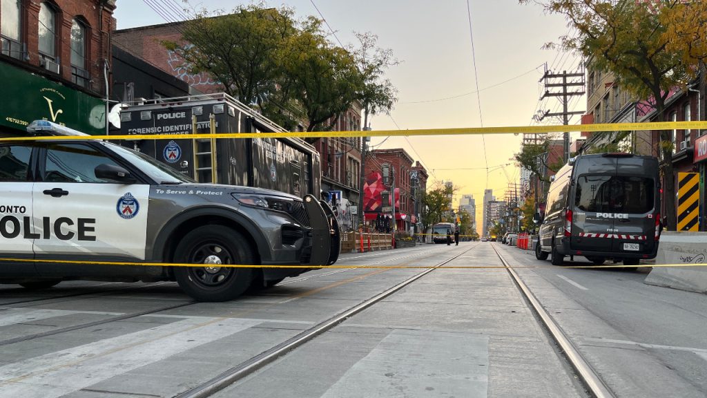 A Toronto police cruiser is seen in a 2022 file photo blocking Queen Street West.
