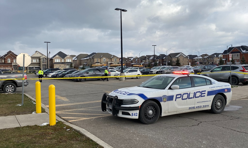 Peel police tape off one of the parking lots at Castlebrooke Secondary School in Brampton on Nov. 18, 2022.