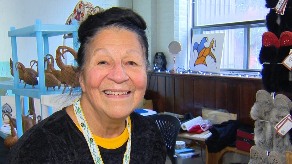 Margaret Cozry stands in front of her booth at the Native Canadian Centre's Indigenous Artisan Market.