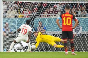 Belgium goalkeeper Thibaut Courtois (1) makes a save on a penalty kick from Canada forward Alphonso Davies