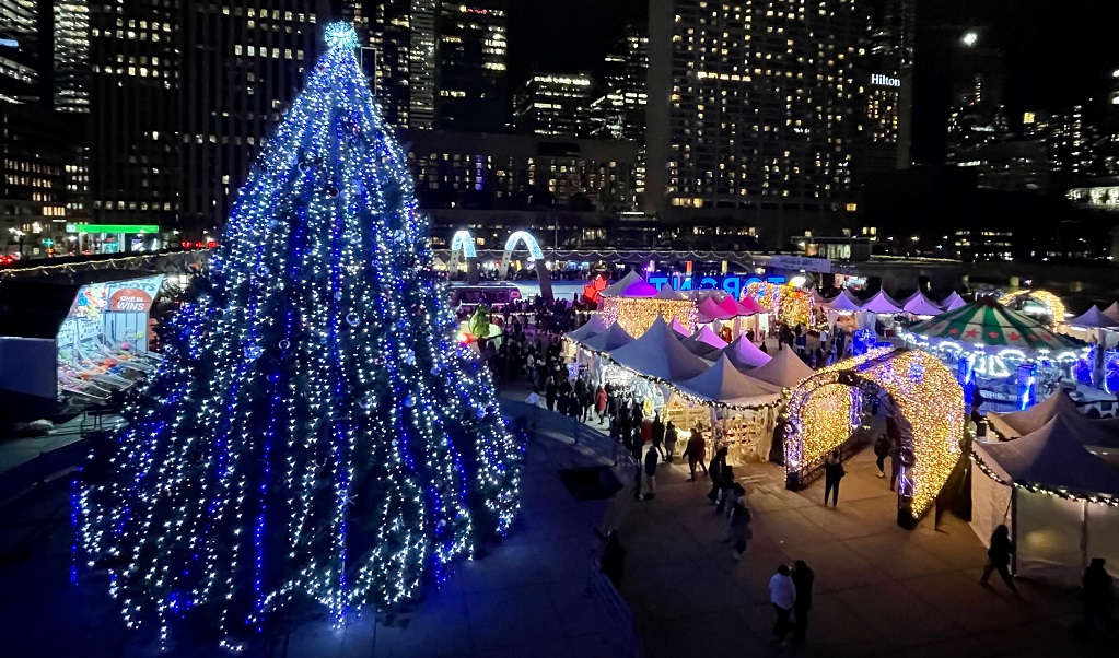 The skating rink at Nathan Phillips Square is surrounded by the Holiday Fair in the Square and the City of Toronto's official Christmas tree
