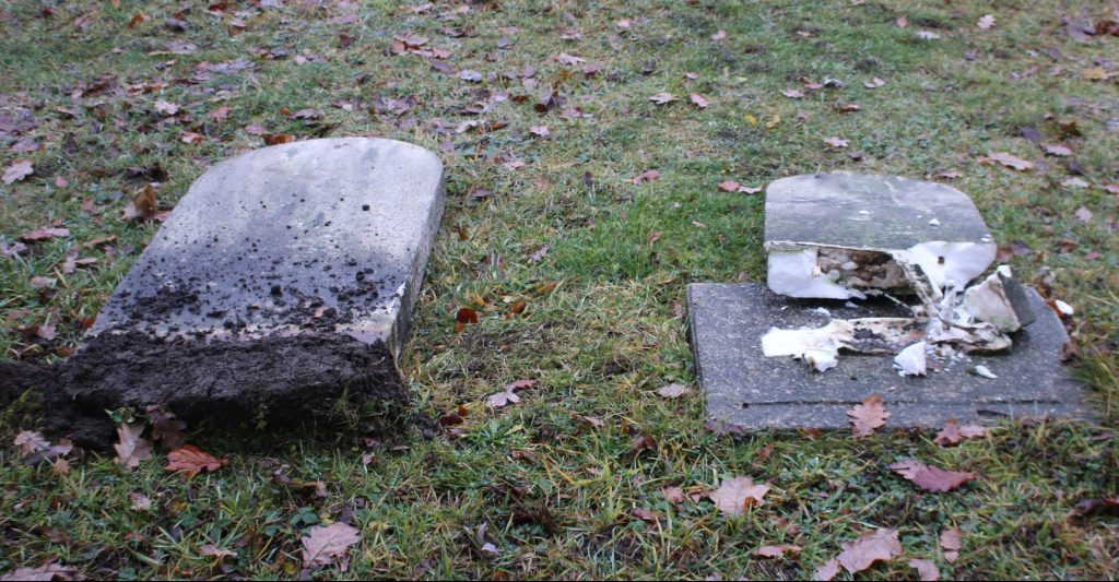 Damaged headstones at a cemetery in Mitchell, Ontario