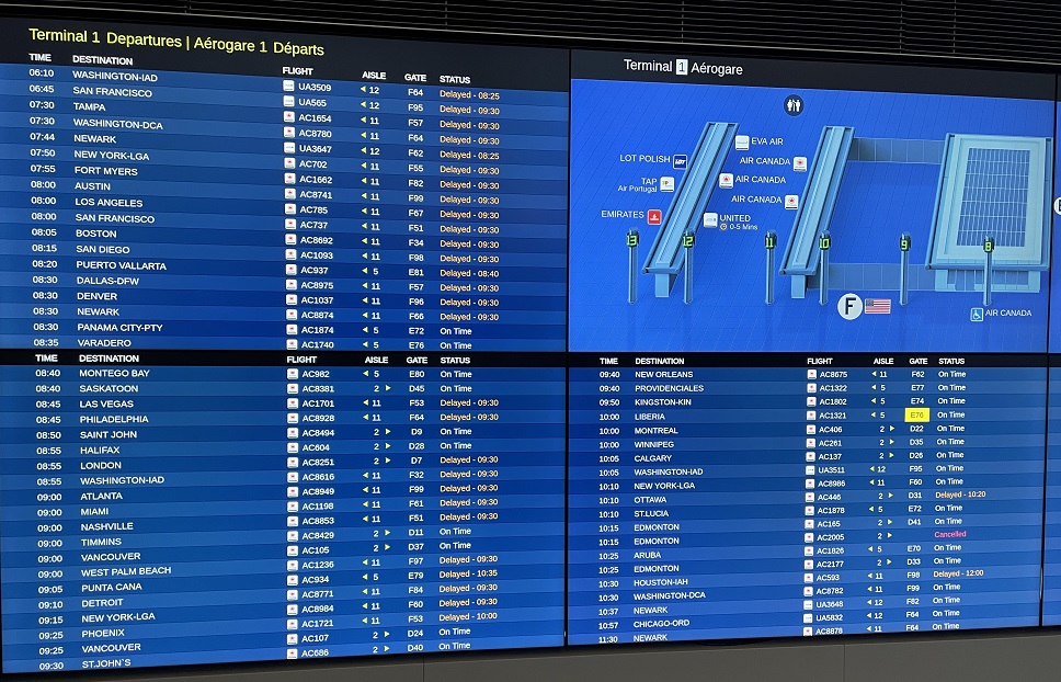 The departures board at Pearson International Airport shows the U.S.-bound flights delayed due to an FAA system outage