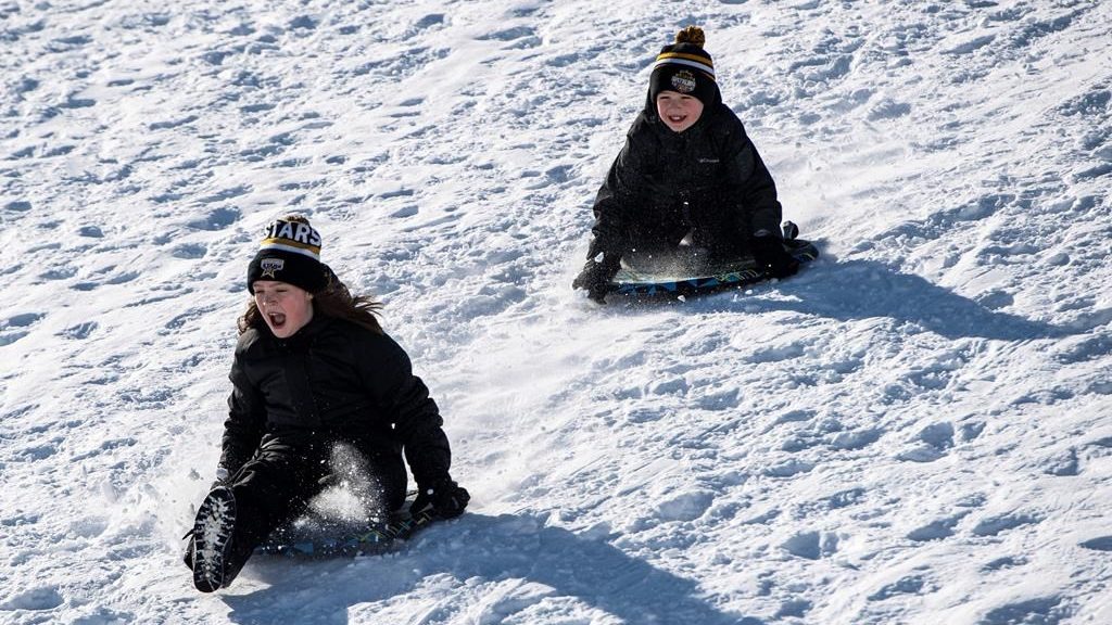 Kids go tobogganing at Lansdowne Park in Ottawa on Family Day, on Feb. 17, 2020
