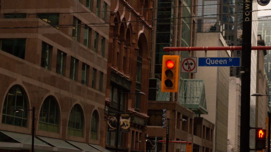 Queen Street road sign at Yonge and Queen intersection