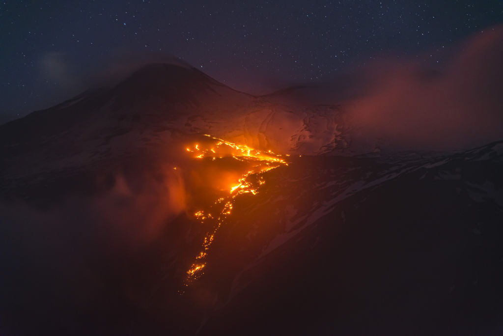 A photo shows an eruption at Volcano Etna