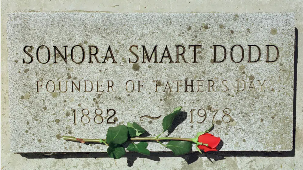 A rose lies on a grave marker of Sonora Smart Dodd at Greenwood Memorial Terrace