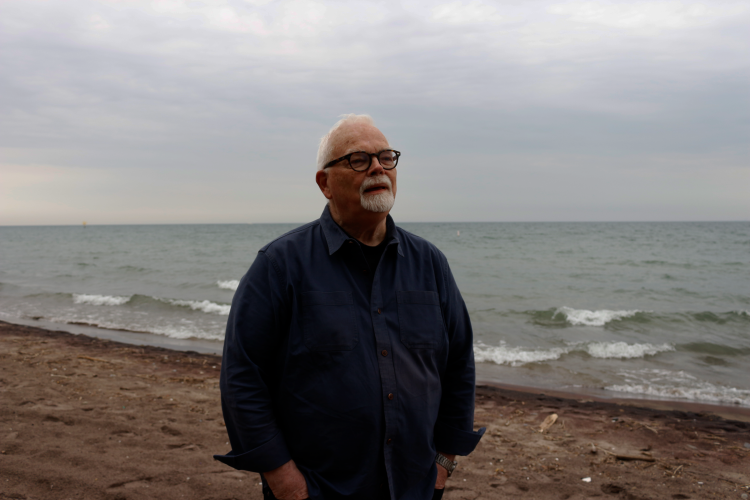 Community historian Ed Jackson looks down the shore at Hanlan’s Point Beach.