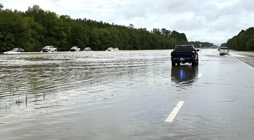 People rescued from cars and homes as torrential rain causes flash