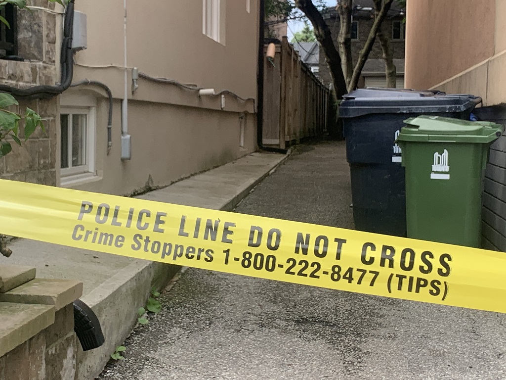 Toronto police off the back of a building on Coxwell Avenue near Robbins Avenue after a stabbing