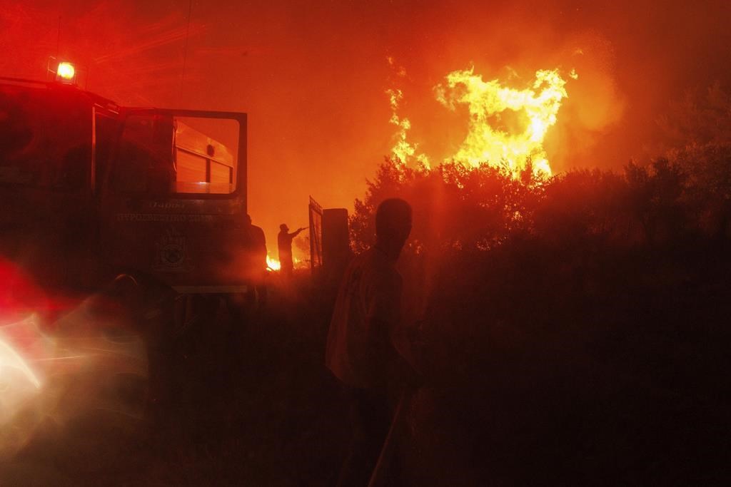 18 bodies found in Greece as firefighters battle wind-driven wildfires across the country