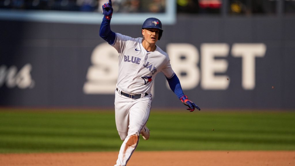 Toronto Blue Jays third baseman Matt Chapman high-fives left