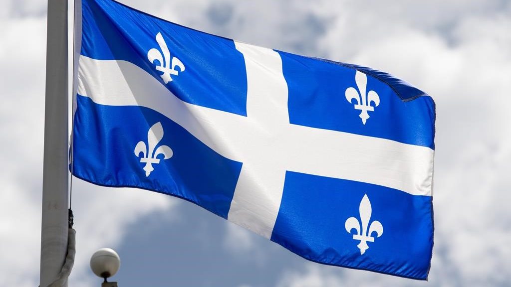 Quebec's provincial flag flies on a flag pole in Ottawa on July 3, 2020