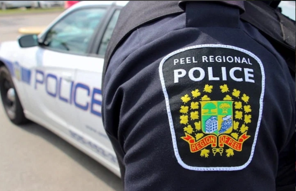 Peel Regional Police badge and cruiser are seen.