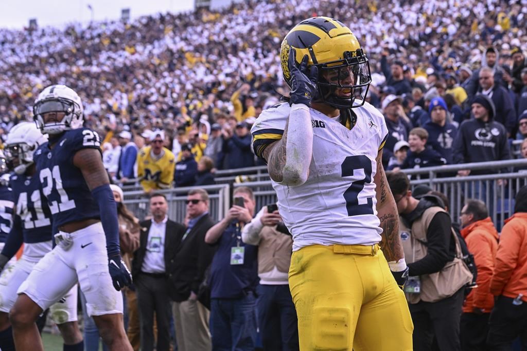 Without Jim Harbaugh No. 2 Michigan grinds past No. 9 Penn State