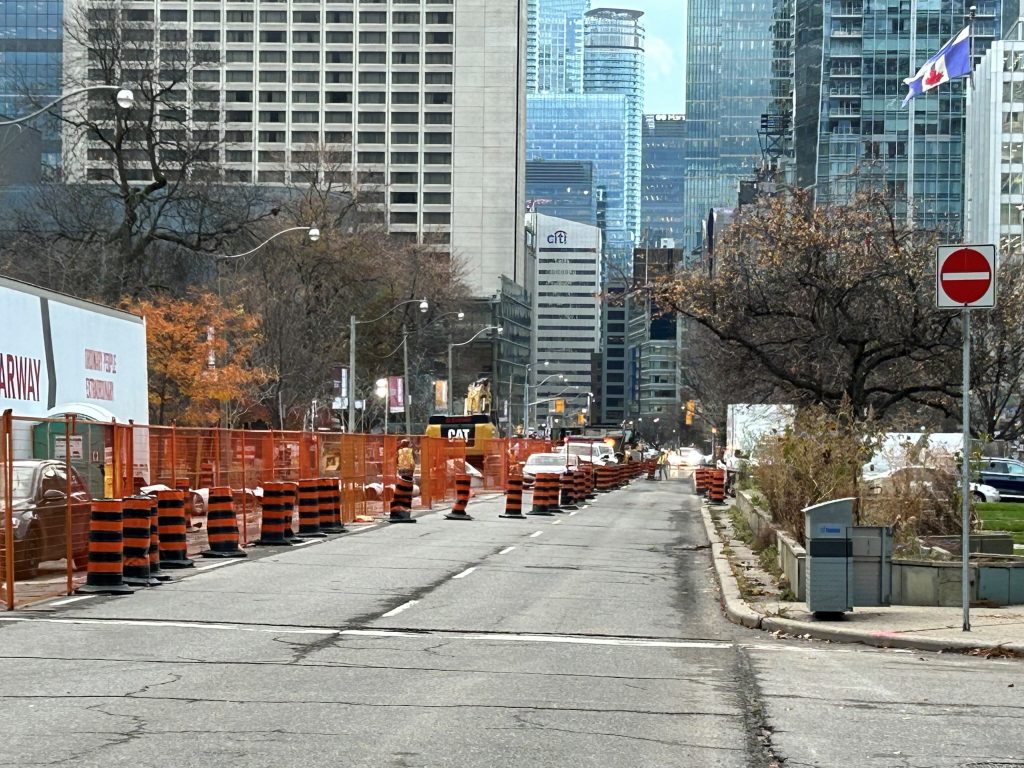 Southbound University Avenue is reduced to a single lane between College Street and Queen Street West