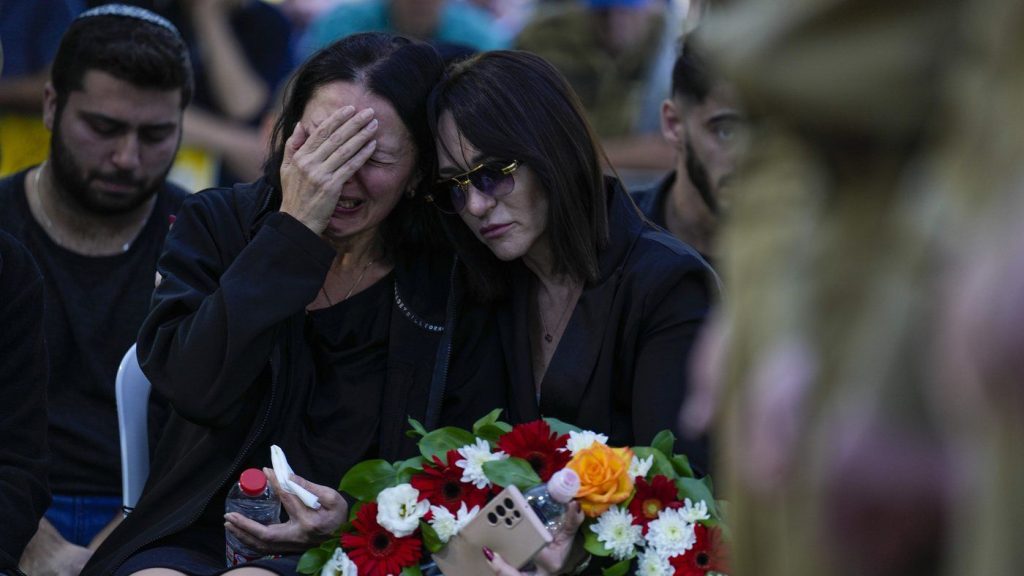 Helena Brodski cries during a memorial service for her son Sergeant Kiril Brodski in the Kiryat Shaul military cemetery in Tel Aviv