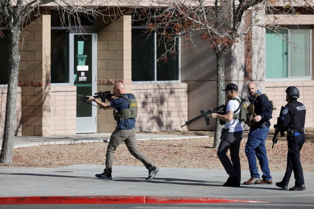 Law enforcement officers head into the University of Nevada