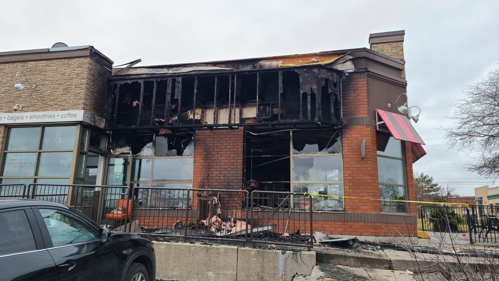 A dumpster fire spread to a Tim Hortons at Brant Street and Upper Middle Road in Burlington on Dec. 21, 2023