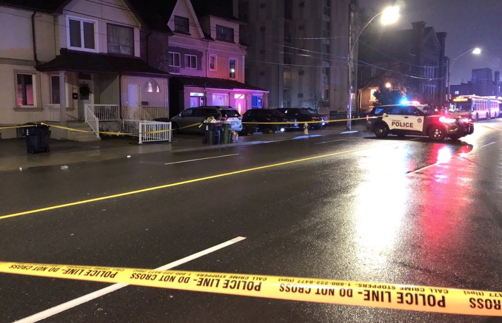 Toronto police officers block off part of Dufferin Street Thursday evening.