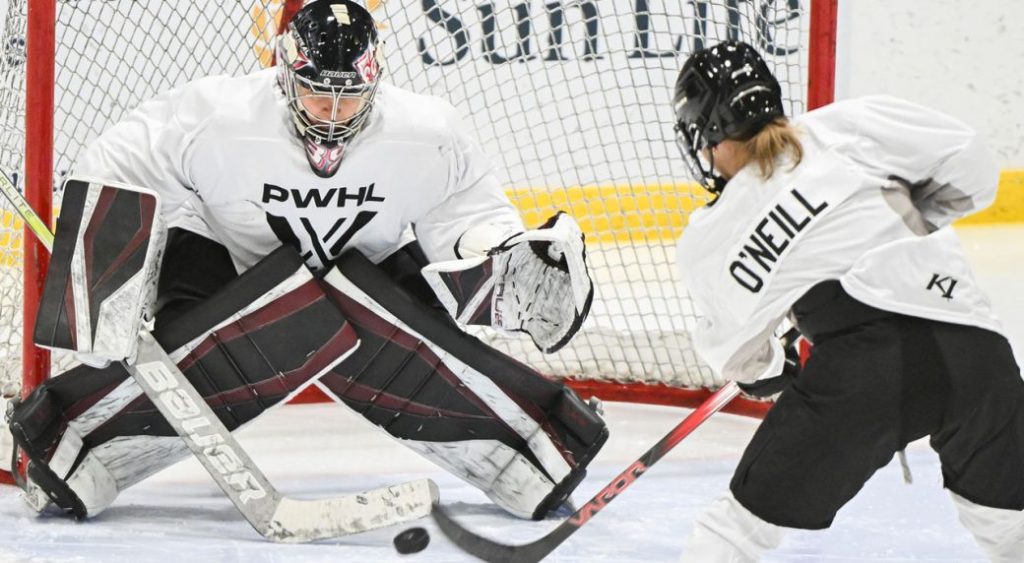 Montreal's Kristin O'Neill moves in on goaltender Ann-Renee Desbiens during the Professional Women's Hockey League’s (PWHL) training camp in Montreal, Saturday, November 18, 2023