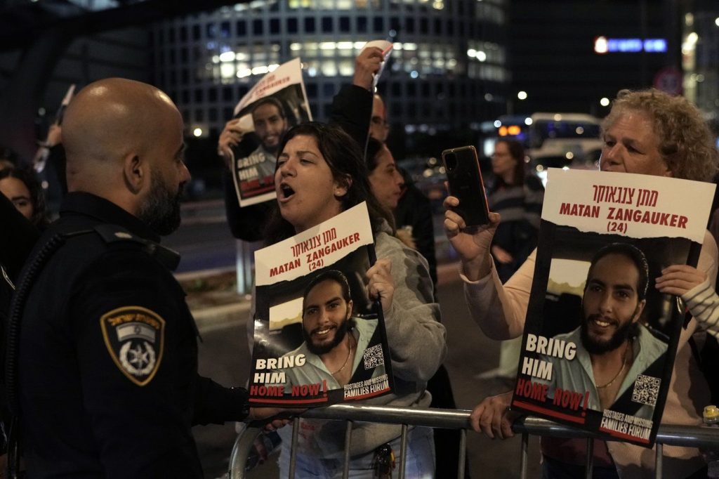 Protesters attempt to block a street during a demonstration in Tel Aviv