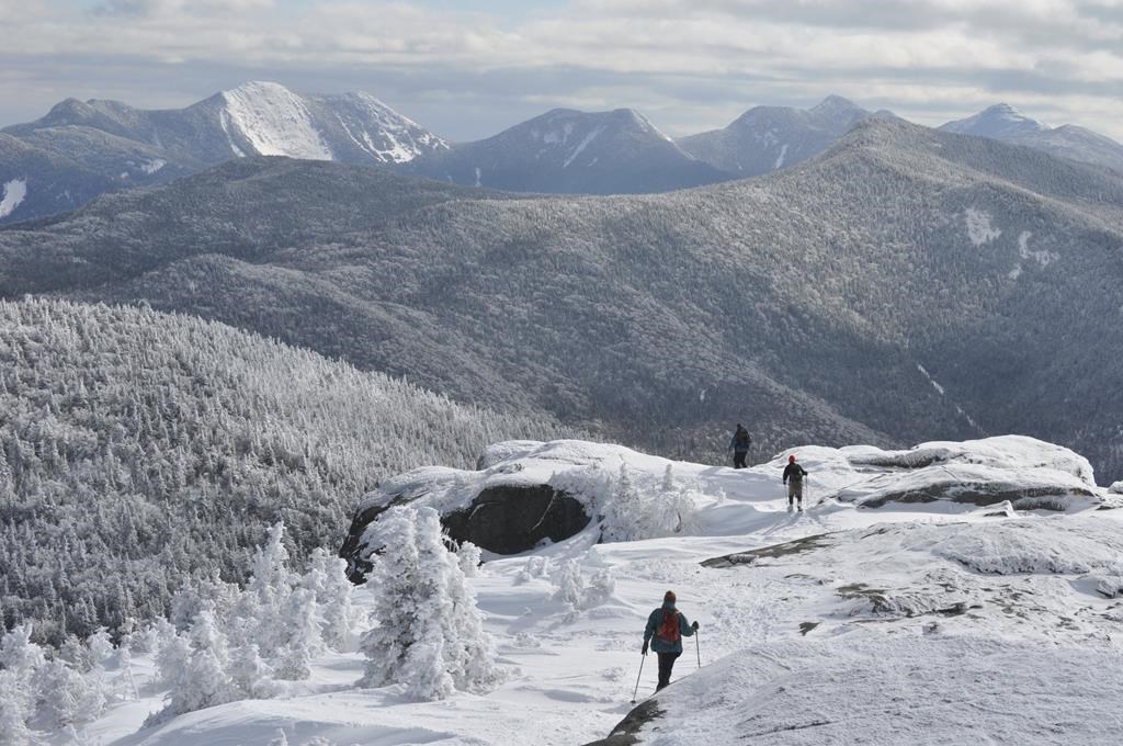 Watch hiker narrowly avoid disaster as he slides over 700ft down icy  mountain