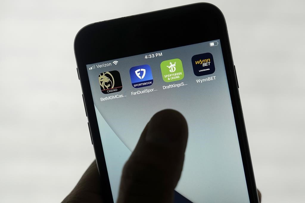 FILE - FanDuel, DraftKings and other online gambling apps are displayed on a phone, Sept. 26, 2022.