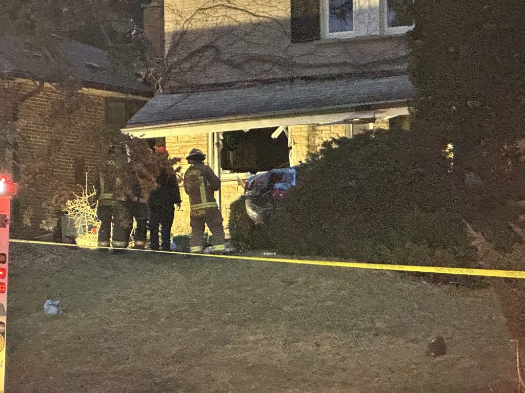 A vehicle drove into the side of a house in Scarborough on February 11, 2024. (Nick Westoll/CITYNEWS)
