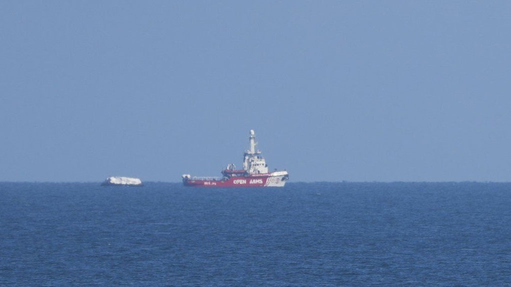 A ship belonging to the Open Arms aid group approaches the shores of Gaza