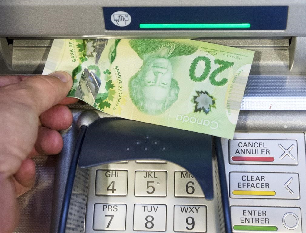 Money is removed from an ATM