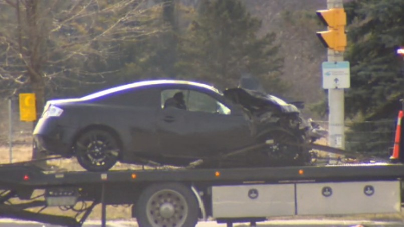 Remains of a car are towed away